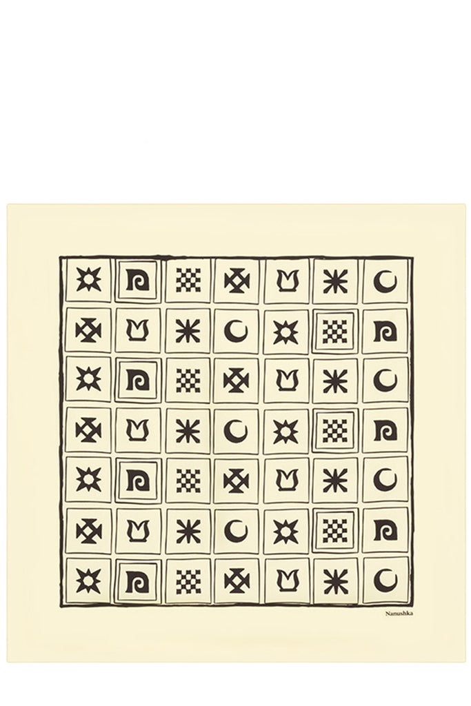 A square art print featuring a 7x7 grid of black geometric and symbolic motifs on a cream-colored background, with a larger central square containing stars, moons, and checkerboard patterns.