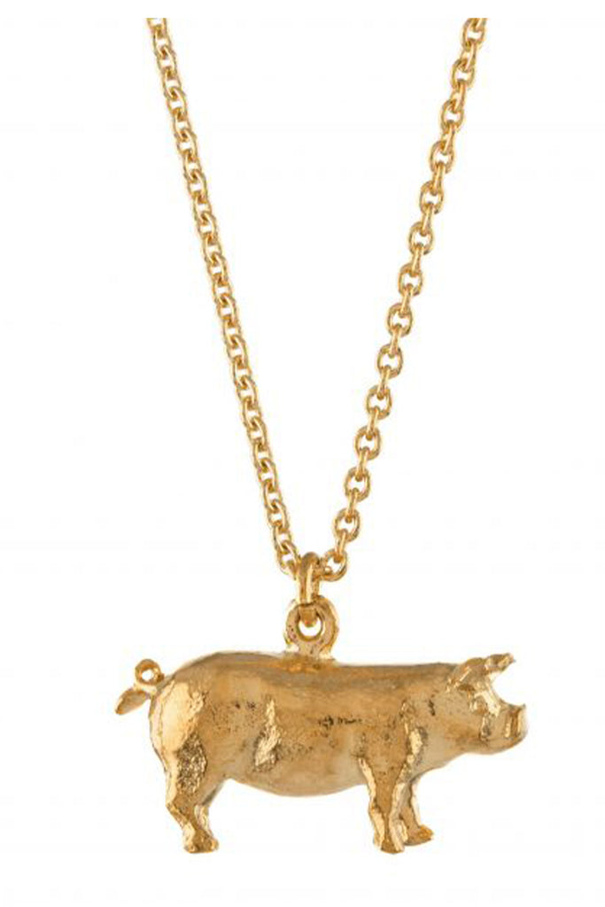 The Suffolk Pig necklace in gold colour from the brand ALEX MONROE