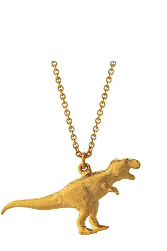 The tyrannosaurus rex necklace in gold colour from the brand ALEX MONROE