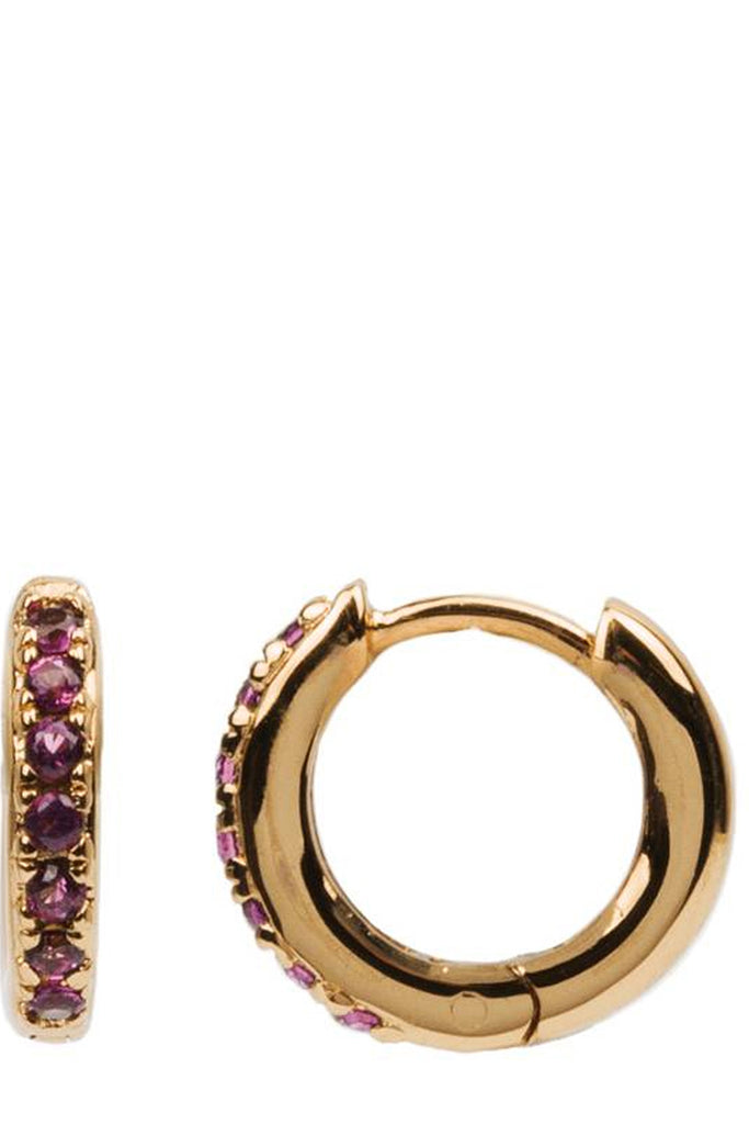 The creole earrings in gold and ruby colour from the brand ALL THE LUCK IN THE WORLD