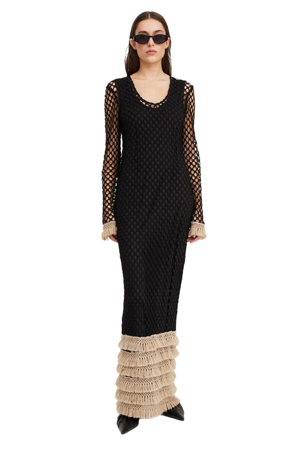 Model wearing the Anae Crochet Maxi Dress in black colour from the brand BY MALENE BIRGER