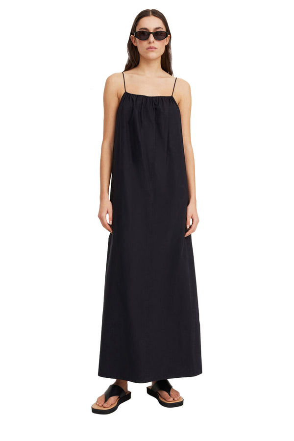 Model wearing the Lanney Organic-Cotton Spaghetti-Strap Maxi Dress in black colour from the brand BY MALENE BIRGER