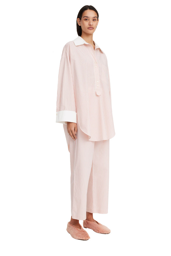 Model wearing the Maye Wide-Cuff Organic-Cotton Shirt in pink colour from the brand BY MALENE BIRGER