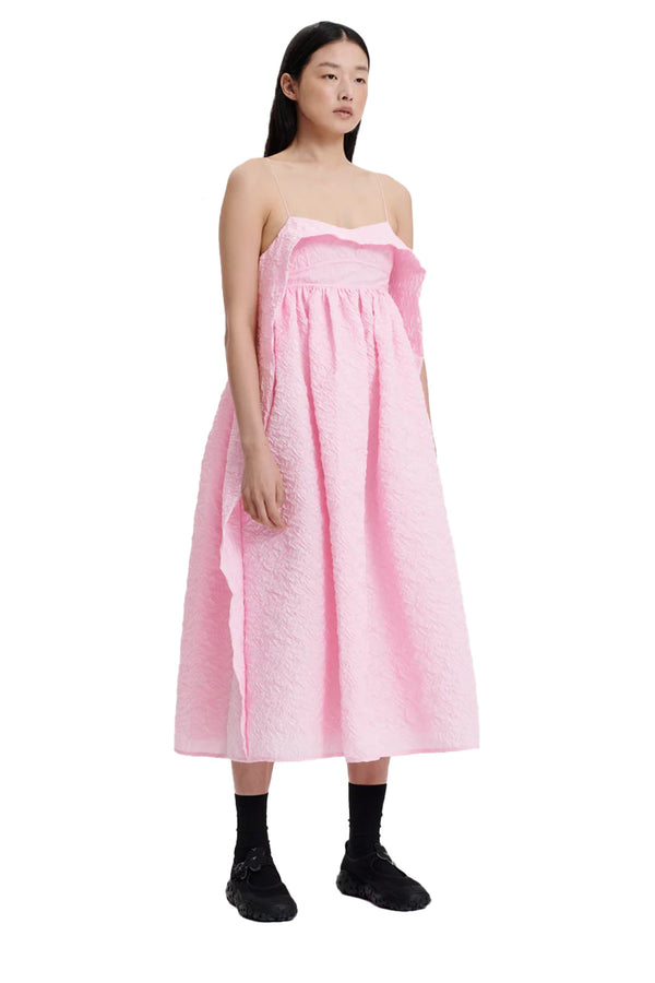 Model wearing the Susa Cut-Out Draped Midi Dress in pink colour from the brand CECILIE BAHNSEN