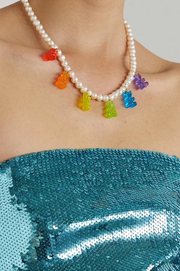 Model wearing the Juanita bear pendant embellished necklace in multicolor color from the brand CRYSTAL HAZE