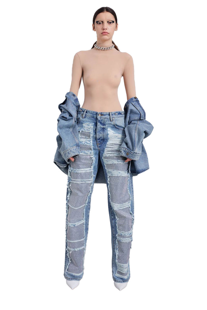 Model wearing the Karen crystal-panel shredded denim jeans in light wash color from the brand DARKPARK