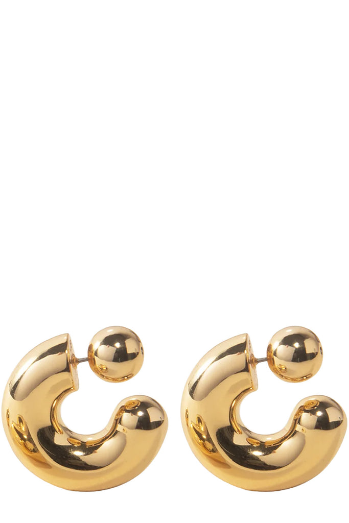 The Tome large hoop earrings in gold colour from the brand JENNY BIRD