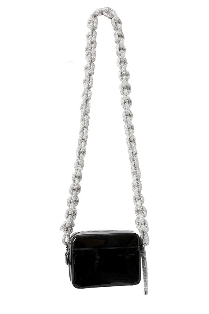 The crystal-embellished leather Cobra camera bag in black and white colours from the brand KARA