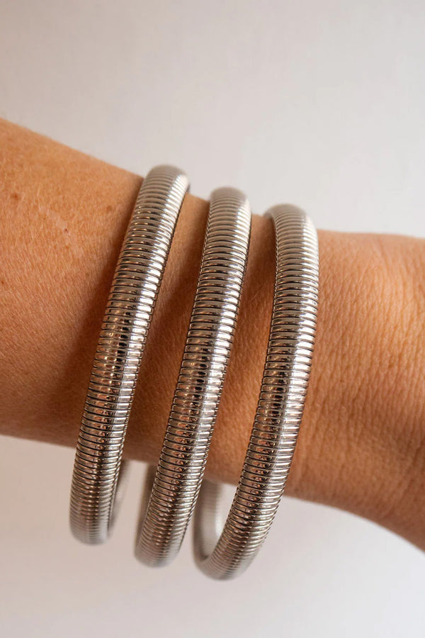 Model wearing the Mini Flex Snake Chain bracelet Set in silver colour from the brand LUV AJ