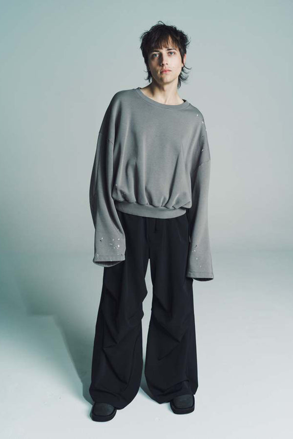Model wearing the Unbrushed Cropped Sweatshirt in taupe colour from the brand MM6 Maison Margiela