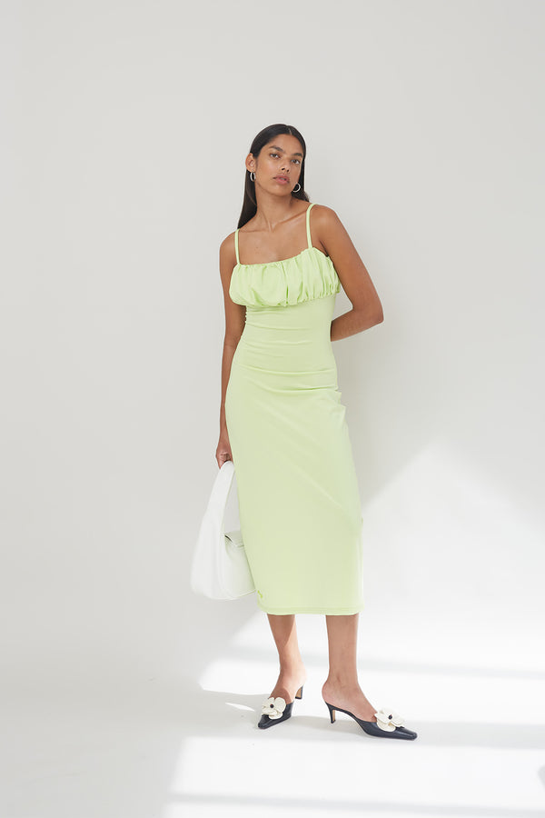 Model wearing the Daisy Dress in Lime Green colour from the brand OpéraSport