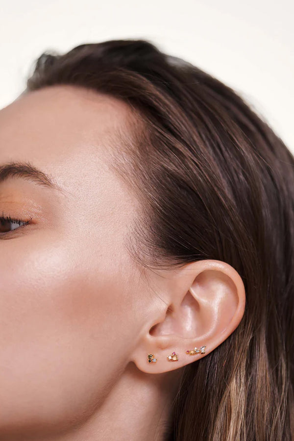 Model wearing the La Palette earrings set in gold and multicolor from the brand P D PAOLA