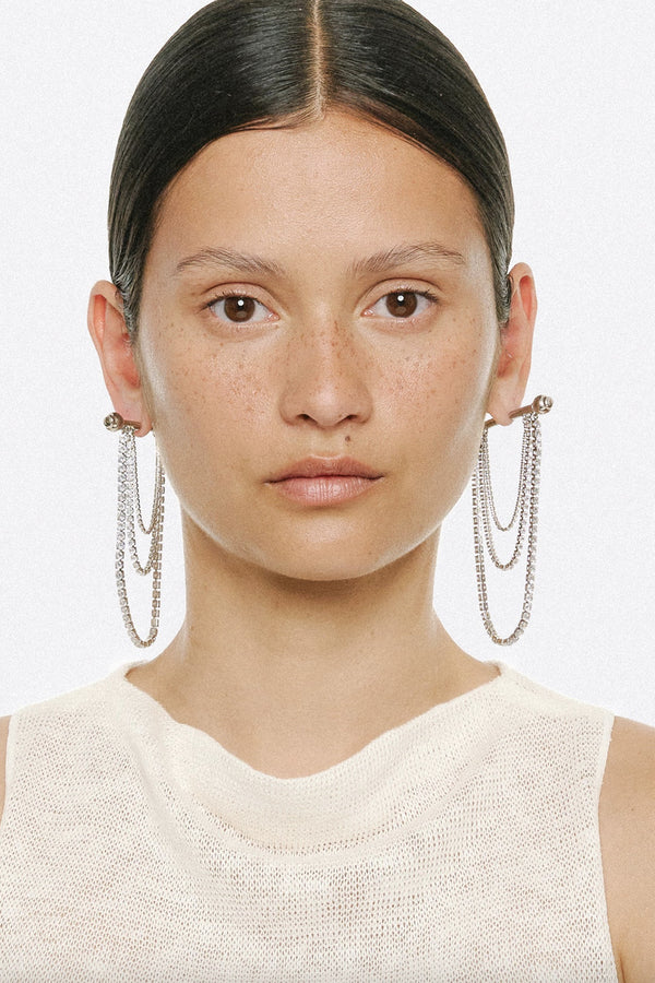 Model wearing the Barbell Chandelier earrings in silver colour from the brand PANCONESI