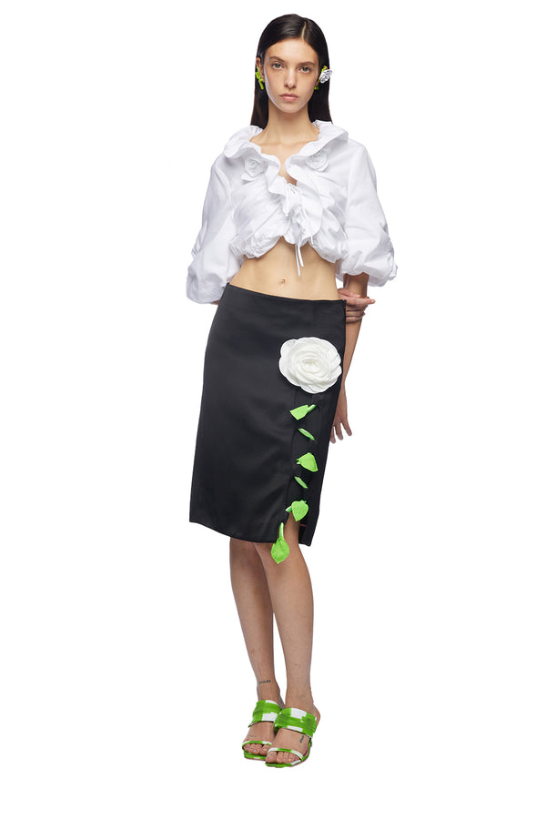 Model wearing the Rose-Embroidery Midi Pencil Skirt in black and green colour from the brand VIVETTA