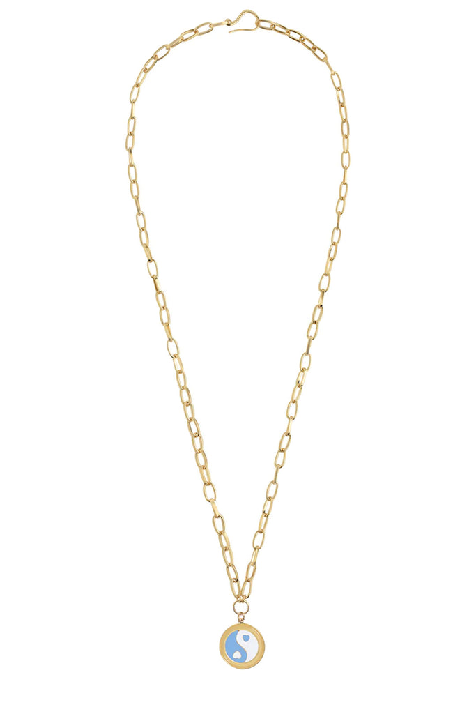 The Yin/Yang necklace in gold and blue colors from the brand WILHELMINA GARCIA